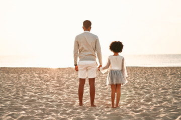 African American family on the beach on the weekend