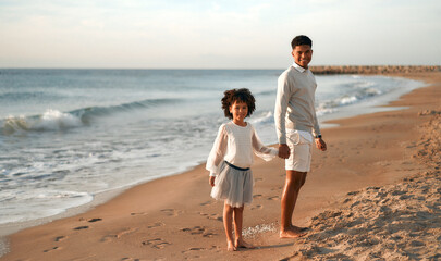 Fototapeta na wymiar African American family on the beach on the weekend