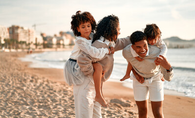 African American family on the beach on the weekend