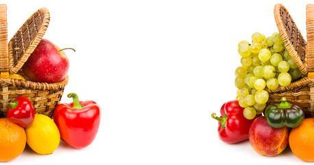 Fruits and vegetables in a basket isolated on a white . Wide photo. Free space for text.