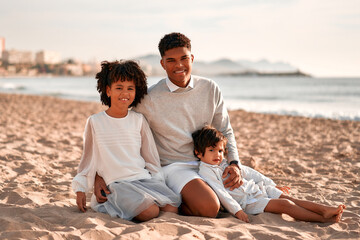 African American family on the beach on the weekend