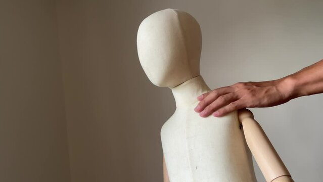 Creepy male hand touching and groping child mannequin body. Child abuse concept. Young children victim of domestic violence.