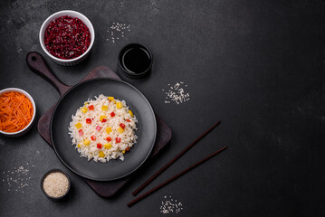 Obraz na płótnie Canvas Tasty Asian dish of rice, pepper, spices and herbs