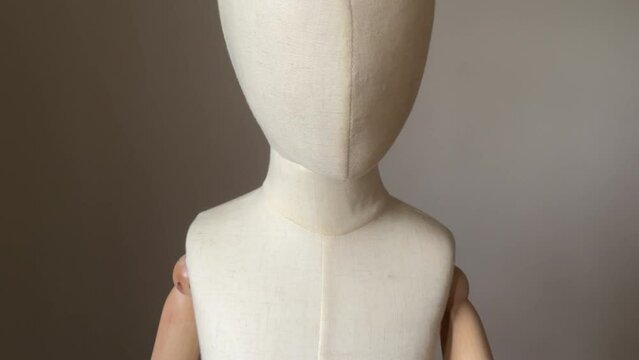 Creepy male hand slapping child mannequin face. Child abuse concept. Young children victim of domestic violence.