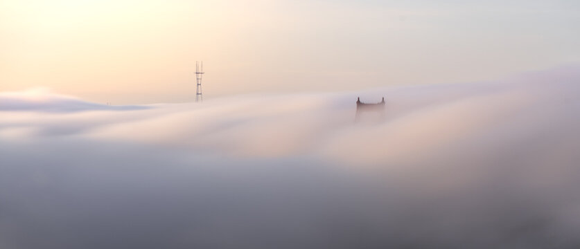 The Golden Gate Bridge and Sutro Tower in the fog. 