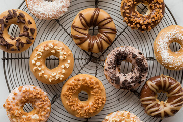 Delicious homemade doughnuts covered with various glazes and toppings.