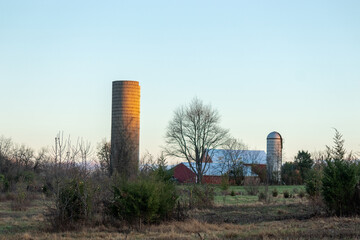 I love the sunset glow that is put on this barn in the middle of the field. Farms are so pretty to me. The sun is setting and the golden hour is here. The clouds drifting in the background sky.