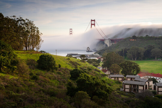 Golden Gate Bridge towering over the hills of Cavallo Point and Fort Baker, in Marin County, California