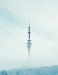 Obraz premium television tower with fog in the morning winter season, Praded, Czech republic