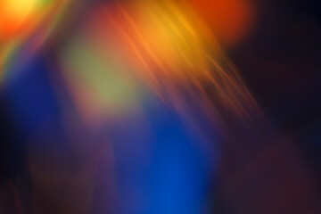 Colorful light leak on black background, abstract design with optical lens flare shot on a long lens. - 550444398