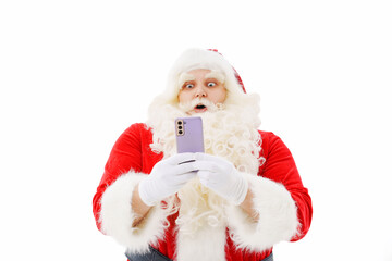 Santa Claus is surprised with a smartphone in his hands on a white background. 