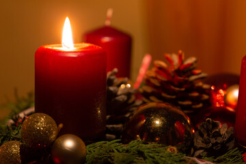 Burning candle and christmas decoration