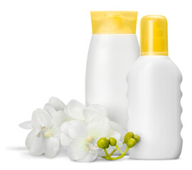 Cosmetic containers and flowers on white table