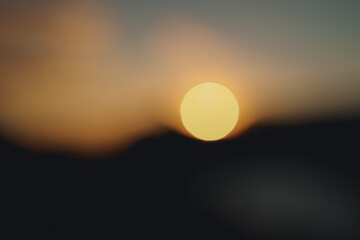 Beautiful sunset in the mountains. Clouds over the sea at sunset.
