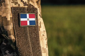 Close up millitary woman or man shoulder arm sleeve with Dominican Republic flag patch. Troops...