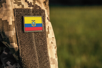 Close up millitary woman or man shoulder arm sleeve with Ecuador flag patch. Ecuador troops army,...