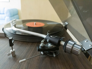 Close-up of a turntable with bent arm