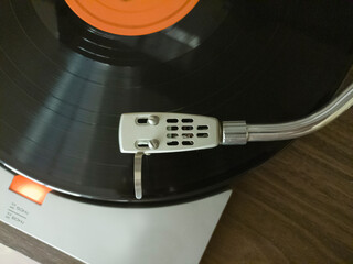 Close-up of a turntable with bent arm