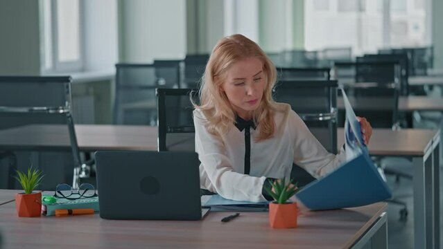 manager trying to find report get nervous at the workplace in office