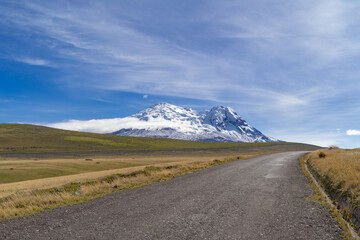 Amazing Antisana volcano, volcanic landscape in the ecological park, road in the mountains