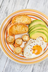 Fried eggs with avocado