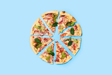 cut pizza fresh hot on a blue background. Top view, flat lay