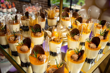 Passion fruit and cape gooseberry - Yellow fruit mousses on the dessert table for a party