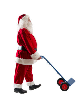 santa claus pushes a trolley to carry parcels to deliver