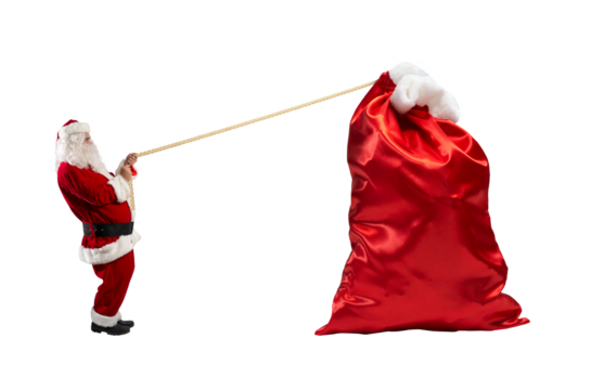 santa claus pulls a rope to move a big sack full of gifts