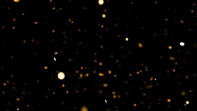 Golden confetti slowly falling down with soft focus. New Year or birthday background Loopable 3D animation.