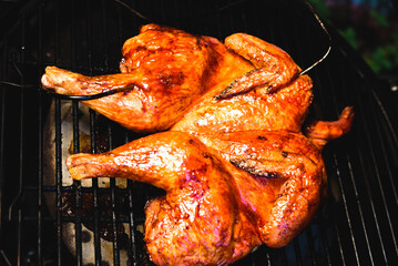 Barbeque cooked whole chicken. BBQ chicken. Whole cooked chicken.