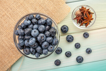 blueberry bowl on wood background top view