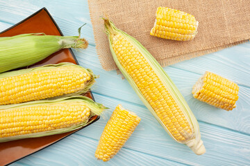 corn on wood background top view