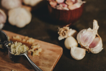 garlic press with garlic cloves