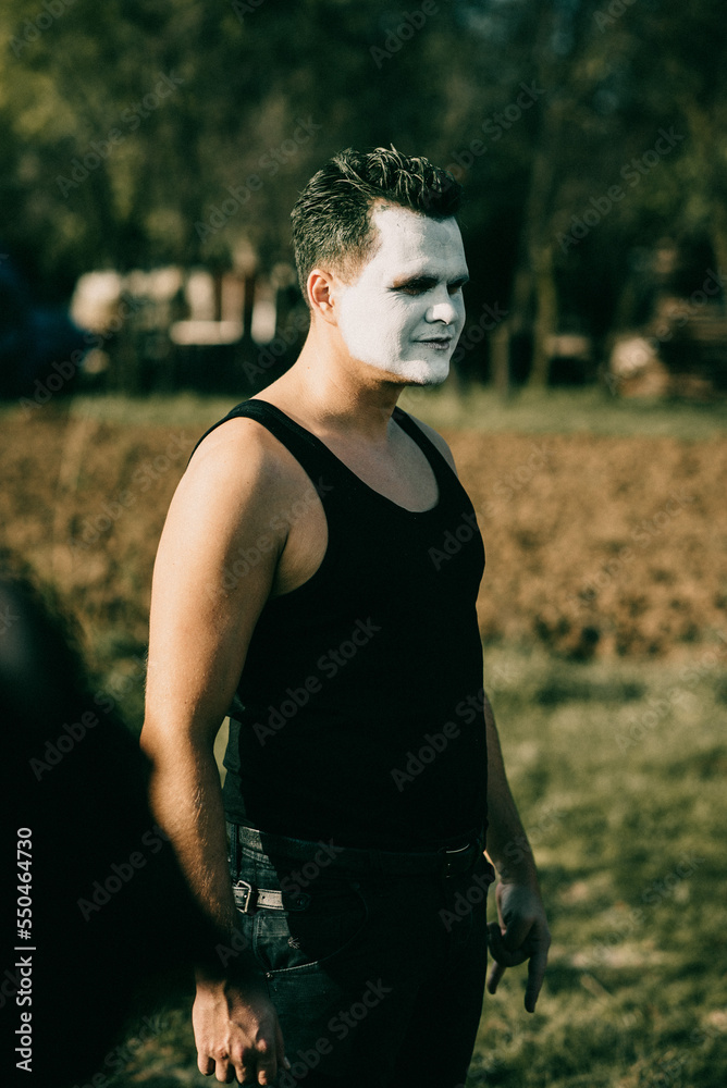 Wall mural Serbian man wearing a joker character during Halloween