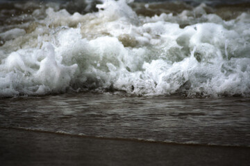 Wave , water flowing over rocks