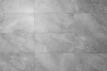Beautiful light grey tiled wall as background, closeup
