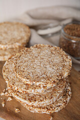 Stack of fresh crunchy rice cakes on white table