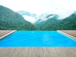 Outdoor swimming pool at luxury resort with beautiful view of mountains