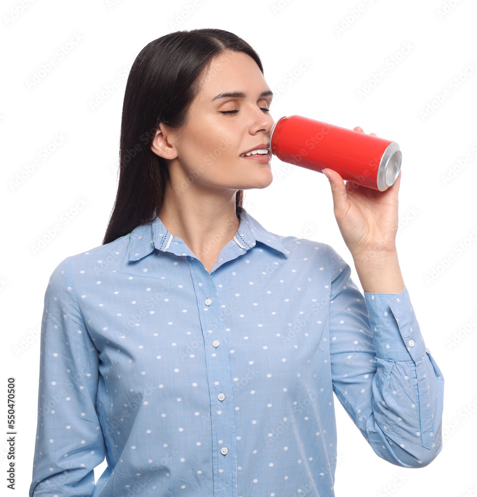 Wall mural Beautiful young woman drinking from tin can on white background