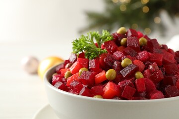Traditional Russian salad vinaigrette in bowl, closeup