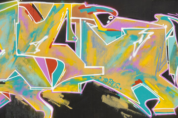 Colorful background of graffiti painting artwork with bright aerosol strips on metal wall. Old...