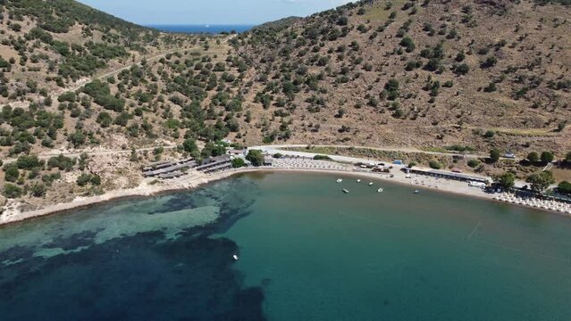 Izmir, Turkey - June 7, 2022: Aerial view of Denizkoy beach with eos camping area with drone.