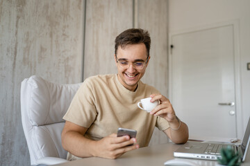 one caucasian man making a phone call at work in the office sitting