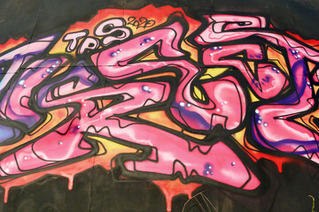 Colorful background of graffiti painting artwork with bright aerosol strips and beautiful colors....