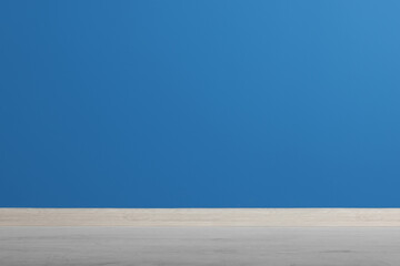 Beautiful blue wall and wooden floor in clean empty room