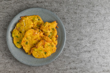 bakwan is vegetable fritter from Indonesia. made from mixed vegetable and flour fried in cooking oil