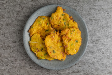 bakwan is vegetable fritter from Indonesia. made from mixed vegetable and flour fried in cooking oil