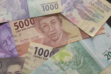 many rupiah banknotes of various denominations