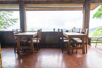 wood bar and chair with mountain hill background